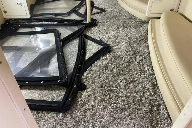 Slide: The Image of Interior of 2007 Fountain 38 Sportfish Cruiser OB with carpet and window panels. - 24