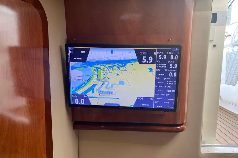 Slide: The Image of Navigation display on 2007 Fountain 38 Sportfish Cruiser OB, showing depth and map details. - 25