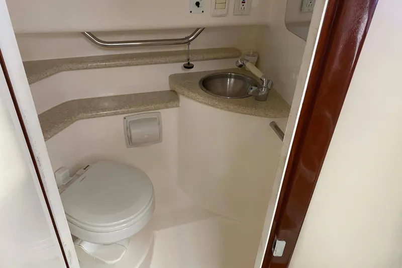 Slide: The Image of Compact bathroom in 2007 Fountain 38 Sportfish Cruiser OB boat. - 26