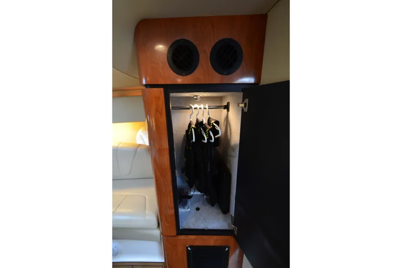 Slide: The Image of 2007 Fountain 38 Sportfish Cruiser OB interior closet with hanging clothes. - 33
