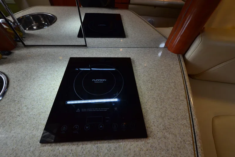Slide: The Image of Luxury yacht kitchen with Furrion induction cooktop, 2007 Fountain 38 Sportfish Cruiser OB. - 35