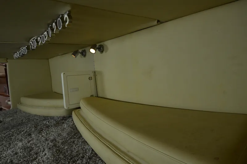 Slide: The Image of 2007 Fountain 38 Sportfish Cruiser OB interior cabin with seating and lighting. - 39