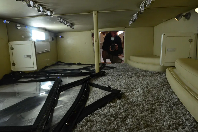 Slide: The Image of Interior cabin of 2007 Fountain 38 Sportfish Cruiser OB with carpet and storage compartments. - 40