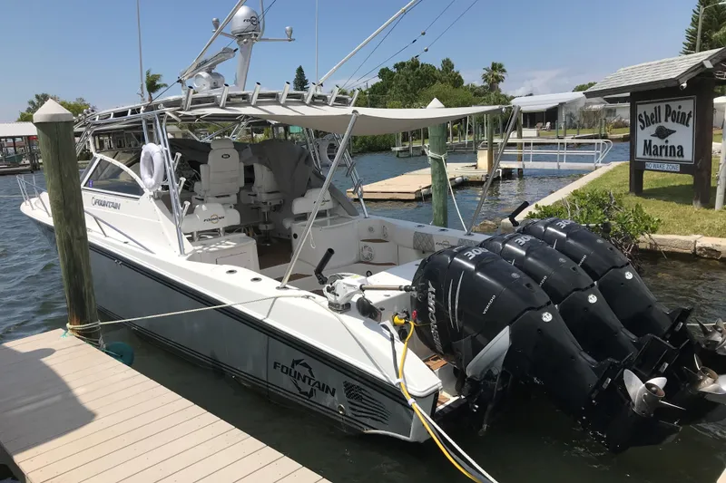 Slide: The Image of 2007 Fountain 38 Sportfish Cruiser OB docked at Shell Point Marina with triple Mercury engines. - 5