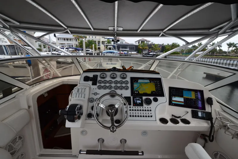 Slide: The Image of Helm of 2007 Fountain 38 Sportfish Cruiser OB with navigation screens and controls. - 7
