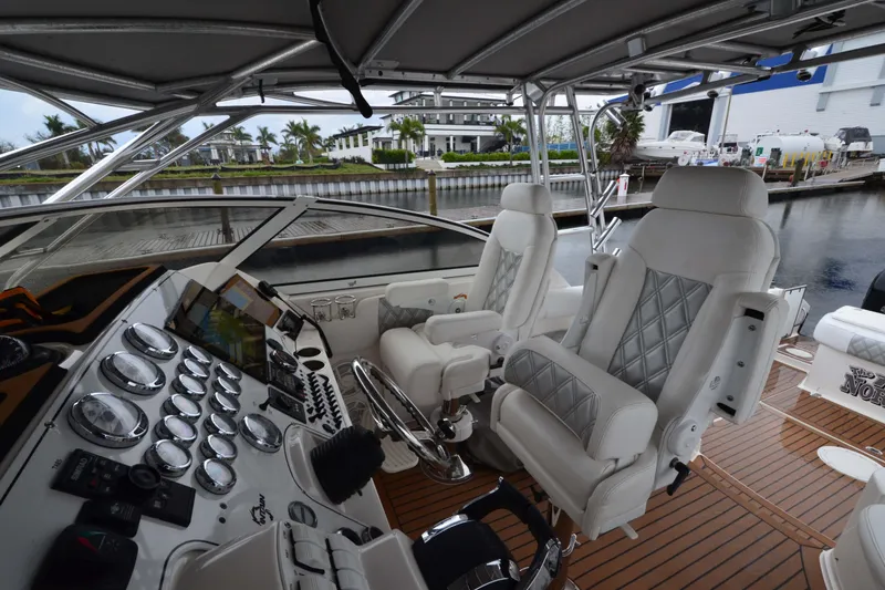 Slide: The Image of 2007 Fountain 38 Sportfish Cruiser OB cockpit with luxurious seating and advanced controls. - 9