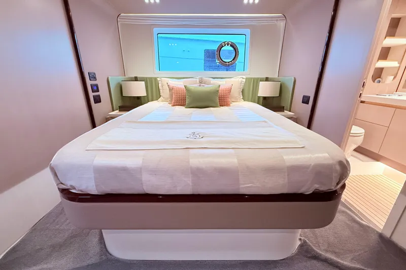 Slide: The Image of Luxurious bedroom interior of 2020 Azimut 60 yacht with elegant bedding and modern decor. - 11