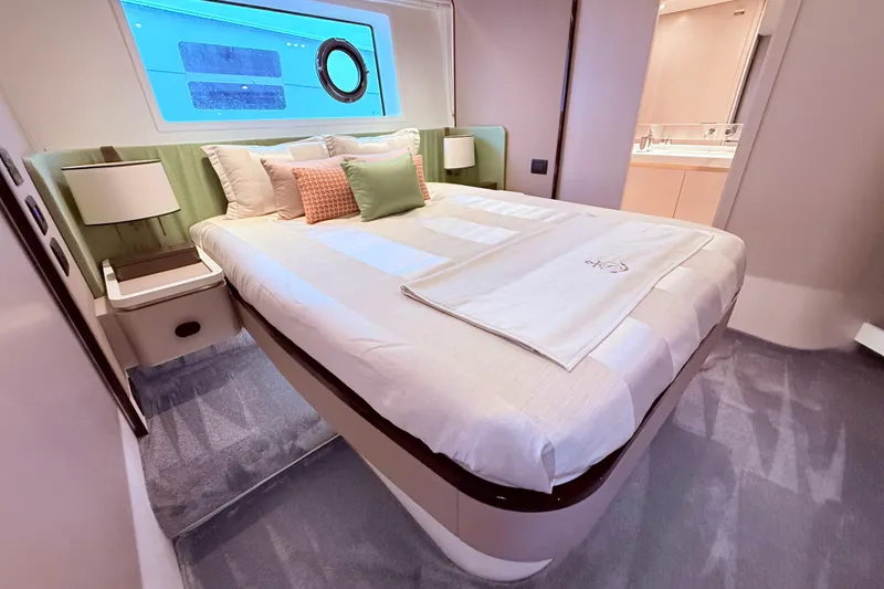 Slide: The Image of Luxurious bedroom interior of 2020 Azimut 60 yacht with elegant decor and modern amenities. - 12