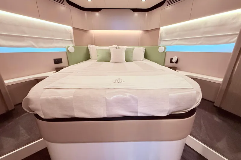 Slide: The Image of Luxurious bedroom interior of 2020 Azimut 60 yacht with modern design and elegant bedding. - 17
