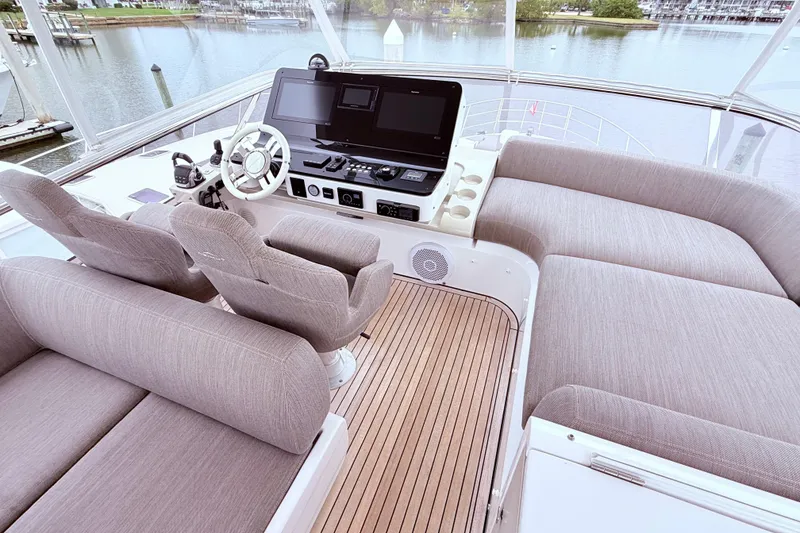Slide: The Image of Luxurious 2020 Azimut 60 yacht helm with plush seating and modern controls. - 22