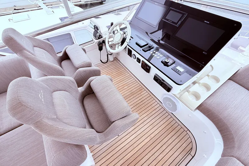 Slide: The Image of Luxurious helm of 2020 Azimut 60 yacht with modern controls and plush seating. - 23