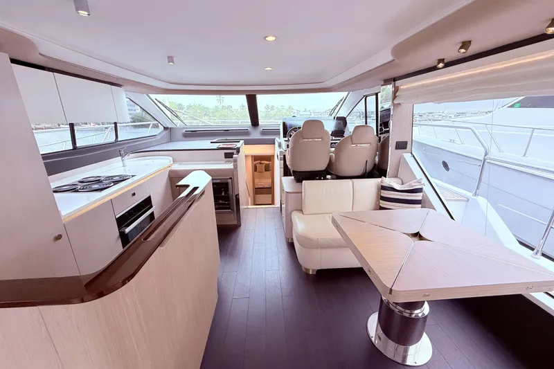Slide: The Image of Luxurious interior of a 2020 Azimut 60 yacht with modern kitchen and seating area. - 3