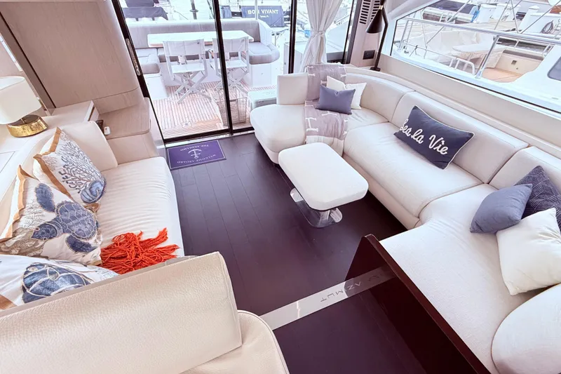Slide: The Image of Luxurious interior of 2020 Azimut 60 yacht with elegant seating and decorative pillows. - 4