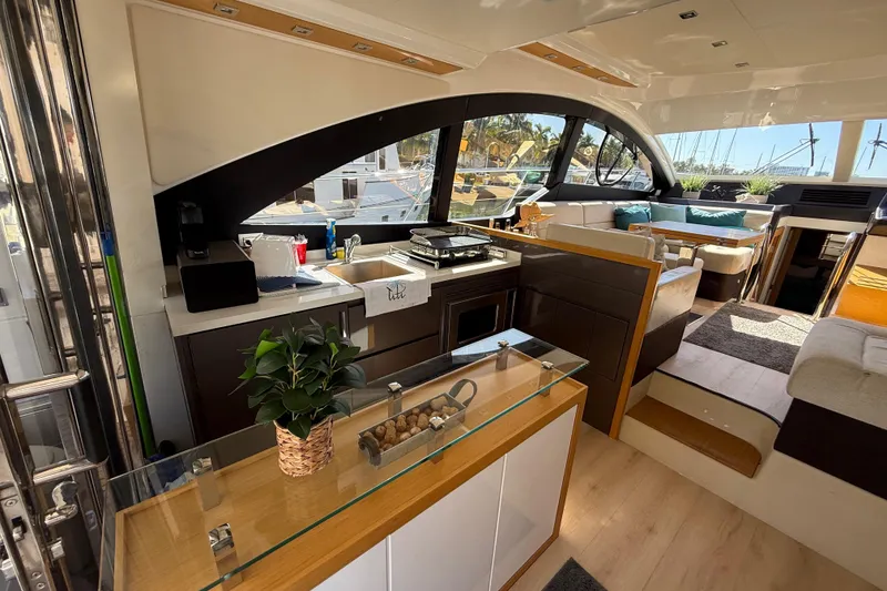 Slide: The Image of Luxurious interior of 2017 Schaefer 56 yacht with modern kitchen and seating area. - 12