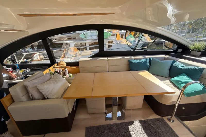 Slide: The Image of Luxurious interior of 2017 Schaefer 56 yacht with elegant seating and wooden table. - 15