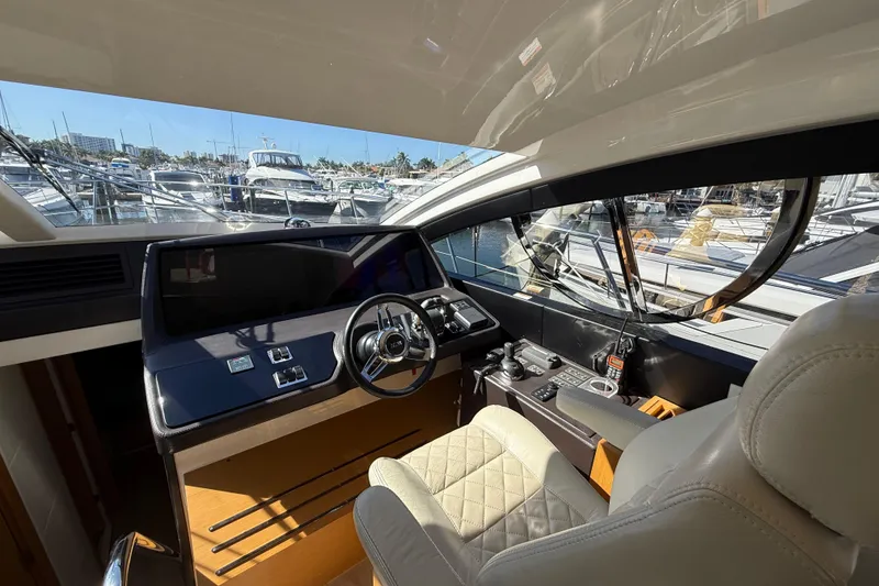 Slide: The Image of Luxurious 2017 Schaefer 56 yacht cockpit with modern steering and navigation controls. - 16