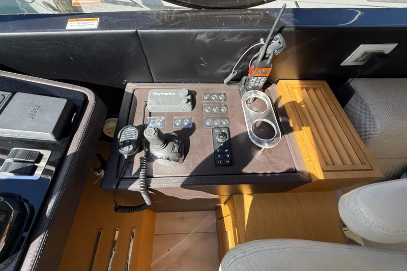 Slide: The Image of Control panel of a 2017 Schaefer 56 yacht with navigation and communication equipment. - 18