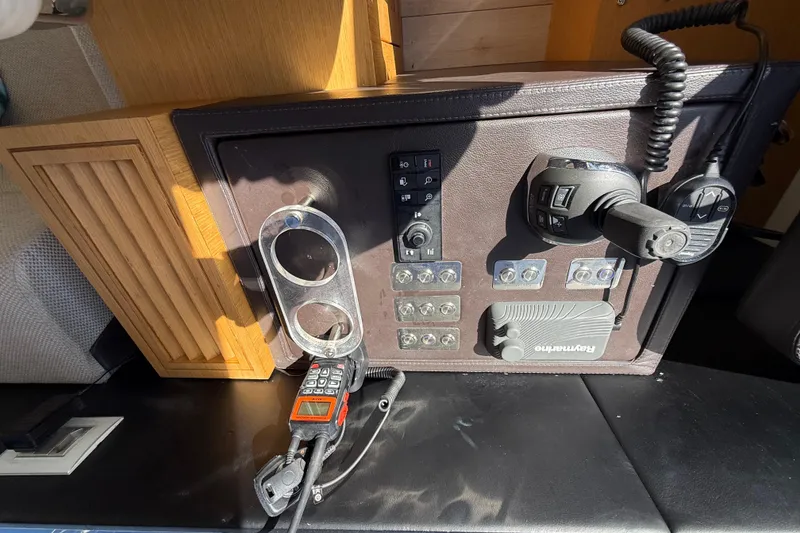 Slide: The Image of Control panel of a 2017 Schaefer 56 yacht with various switches and devices. - 19