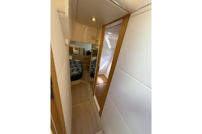 Slide: The Image of Narrow hallway in 2017 Schaefer 56 yacht with mirrored door and cozy bedroom. - 22