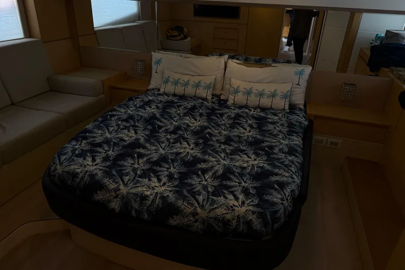 Slide: The Image of Luxurious Schaefer 56 yacht bedroom interior, 2017 model, with palm-themed bedding. - 25