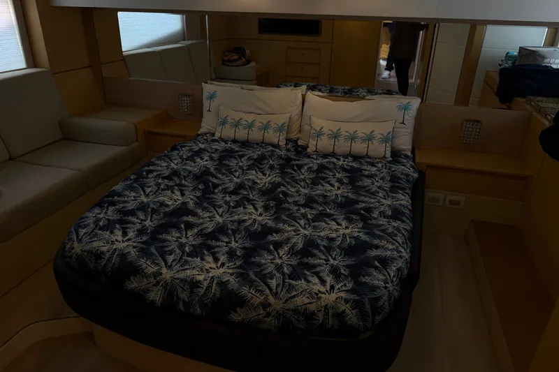 Slide: The Image of Luxurious Schaefer 56 yacht bedroom with palm-themed bedding, 2017 model. - 26
