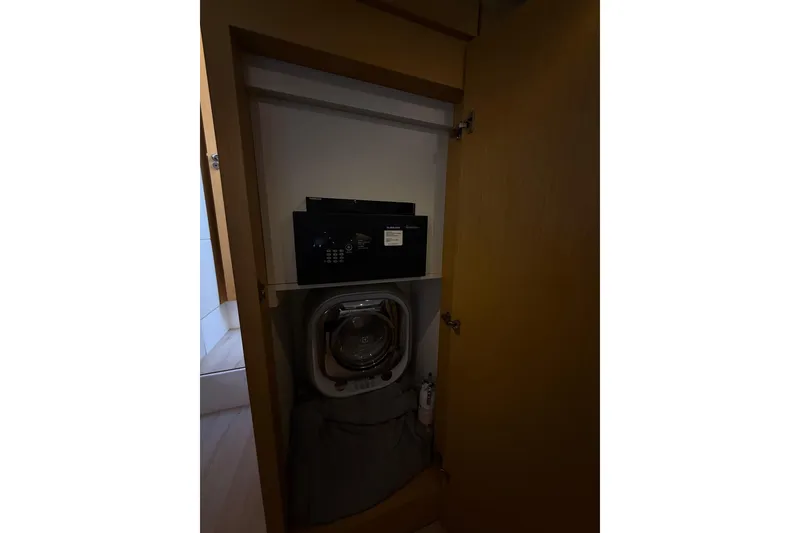 Slide: The Image of Safe and washing machine inside a wooden cabinet on a Schaefer 56 yacht. - 27