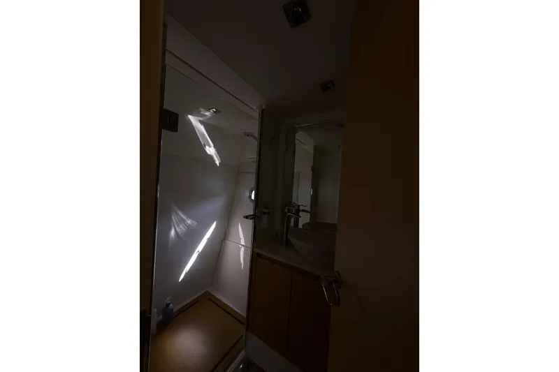 Slide: The Image of Interior of 2017 Schaefer 56 yacht bathroom with modern fixtures and lighting. - 28