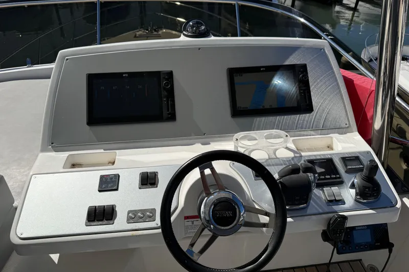 Slide: The Image of Helm of 2017 Schaefer 56 yacht with navigation screens and controls. - 36