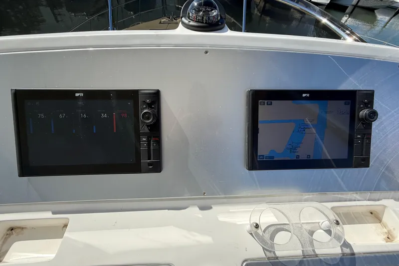 Slide: The Image of Control panel of a 2017 Schaefer 56 yacht with navigation screens. - 37