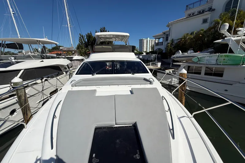 Slide: The Image of Luxury Schaefer 56 yacht from 2017 docked at marina under clear blue sky. - 42