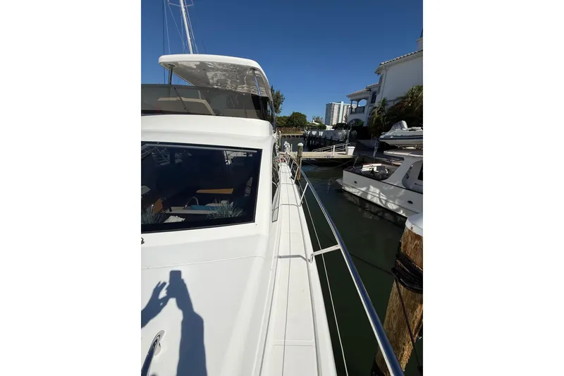 Slide: The Image of 2017 Schaefer 56 yacht docked at marina, sunny day, clear blue sky. - 46