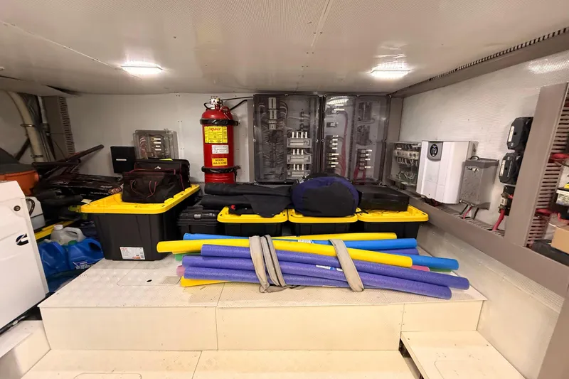 Slide: The Image of Storage area in a 2017 Schaefer 56 yacht with equipment and pool noodles. - 48