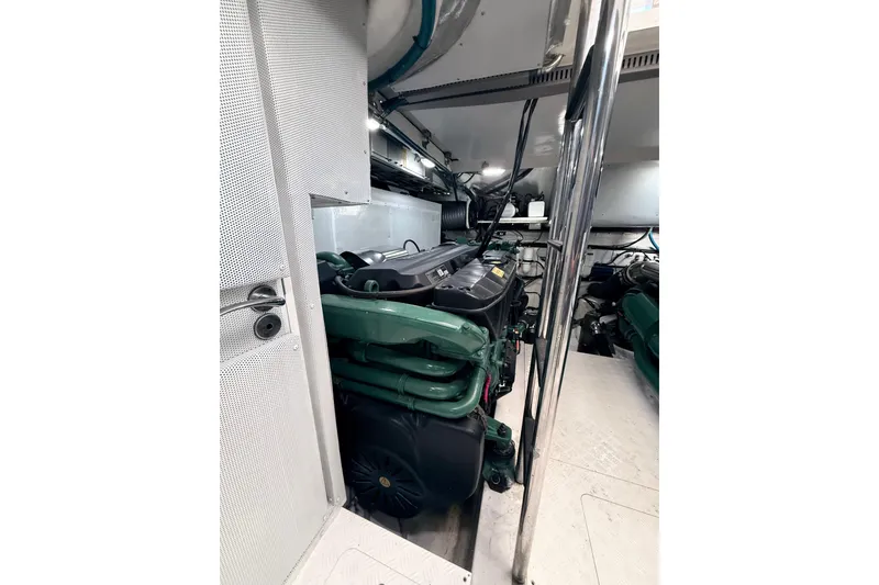 Slide: The Image of Engine room of 2017 Schaefer 56 yacht, showcasing green machinery and metallic structures. - 50