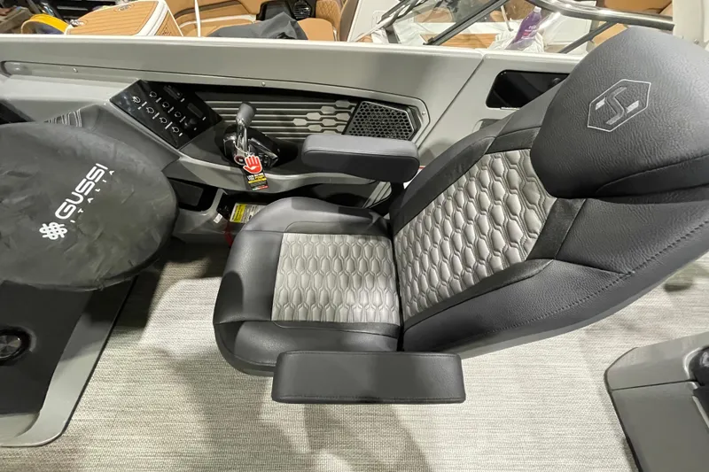 Slide: The Image of Captain's seat of 2026 Harris Crowne 250 boat with Gussi Italia steering wheel. - 23