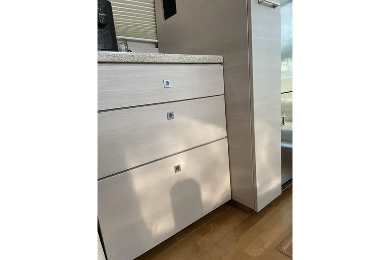 Slide: The Image of Interior cabinetry of a 2008 Sea Ray 47 Sedan Bridge yacht, featuring sleek, modern design. - 17