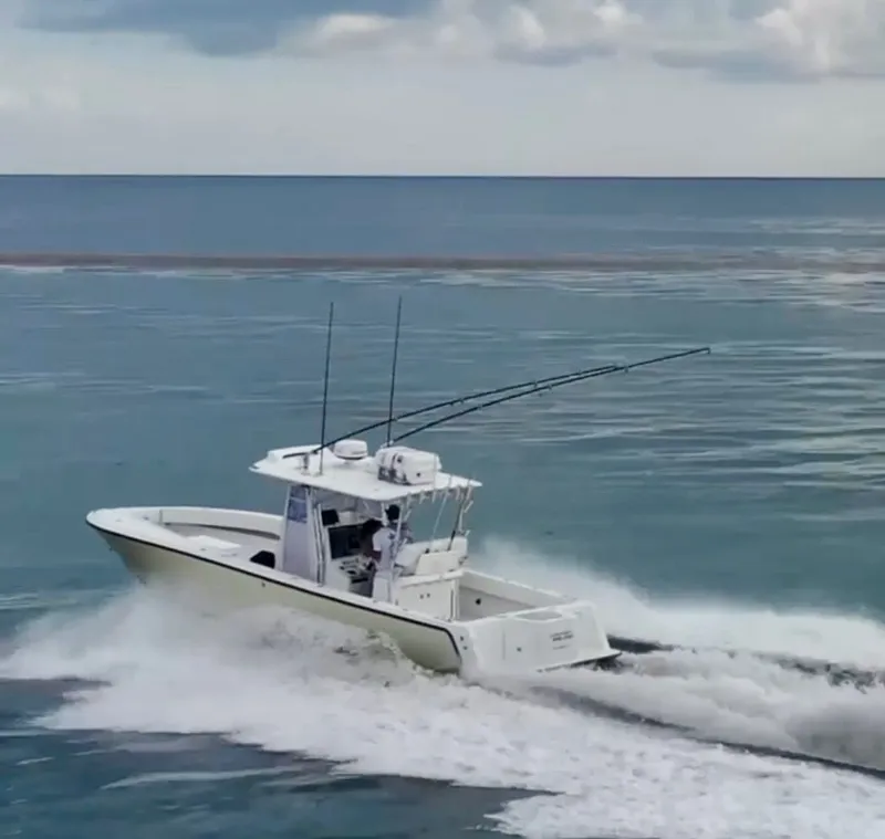 Slide: The Image of SeaVee 340i boat from 2000 cruising on the sea. - 11