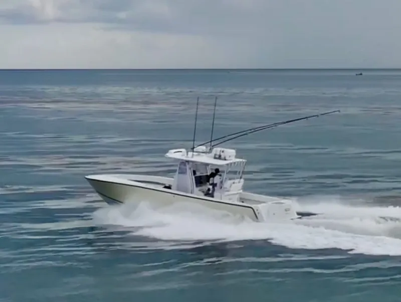 Slide: The Image of SeaVee 340i boat from 2000 cruising on the sea. - 12