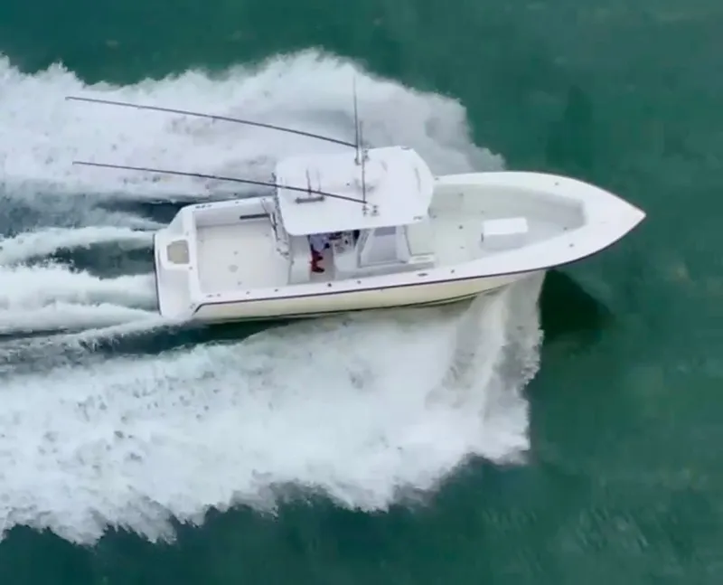 Slide: The Image of Aerial view of a 2000 SeaVee 340i boat on the water. - 14