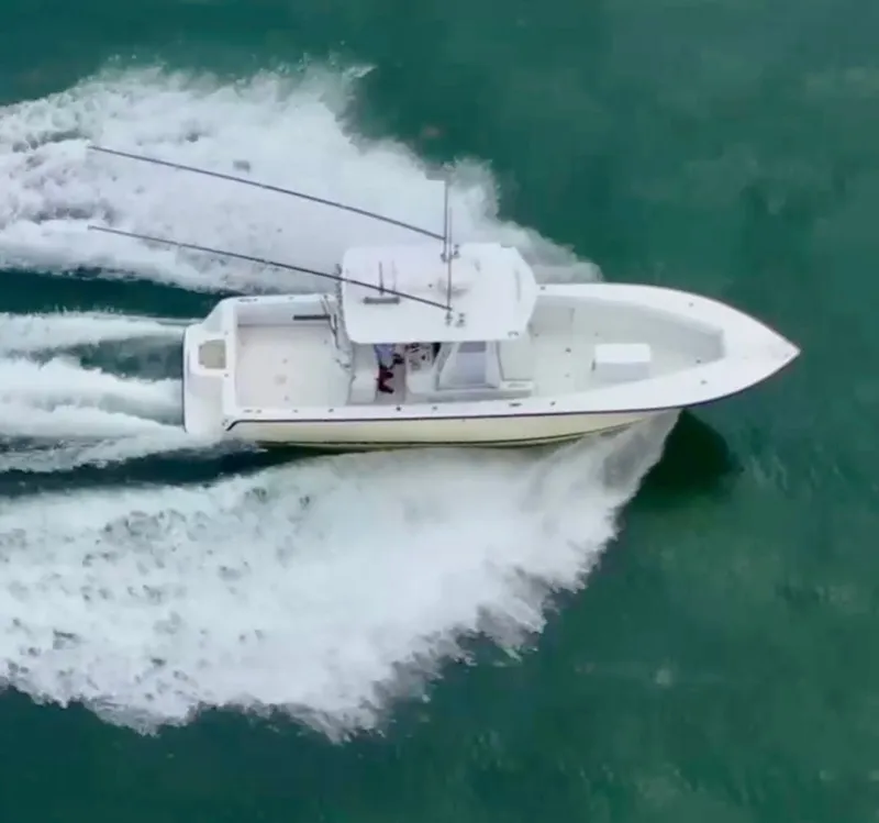 Slide: The Image of Aerial view of a 2000 SeaVee 340i boat on the water. - 15