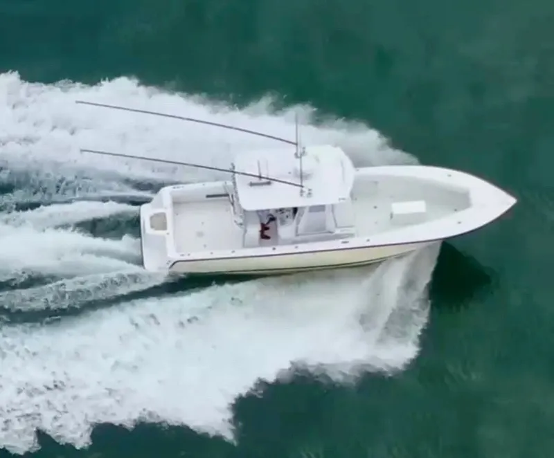 Slide: The Image of SeaVee 340i boat from 2000 cruising on water. - 16