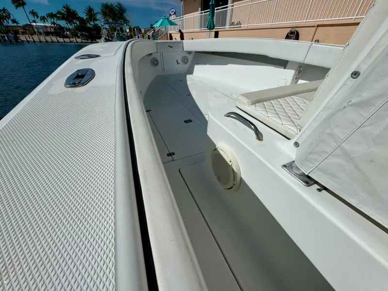 Slide: The Image of Interior view of a 2000 SeaVee 340i boat by the water. - 20