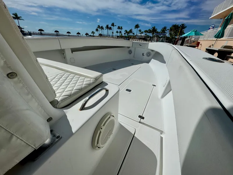 Slide: The Image of Interior view of a 2000 SeaVee 340i boat with white upholstery. - 21