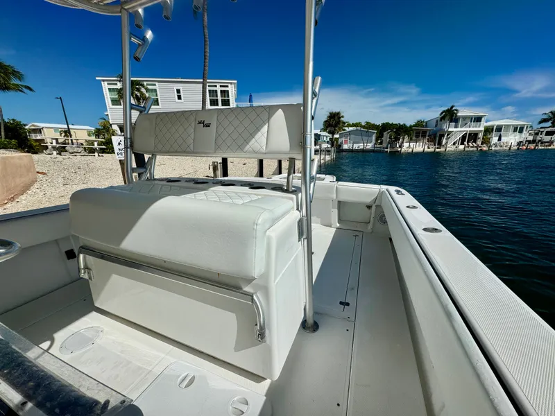 Slide: The Image of Interior of a 2000 SeaVee 340i boat by the water. - 26
