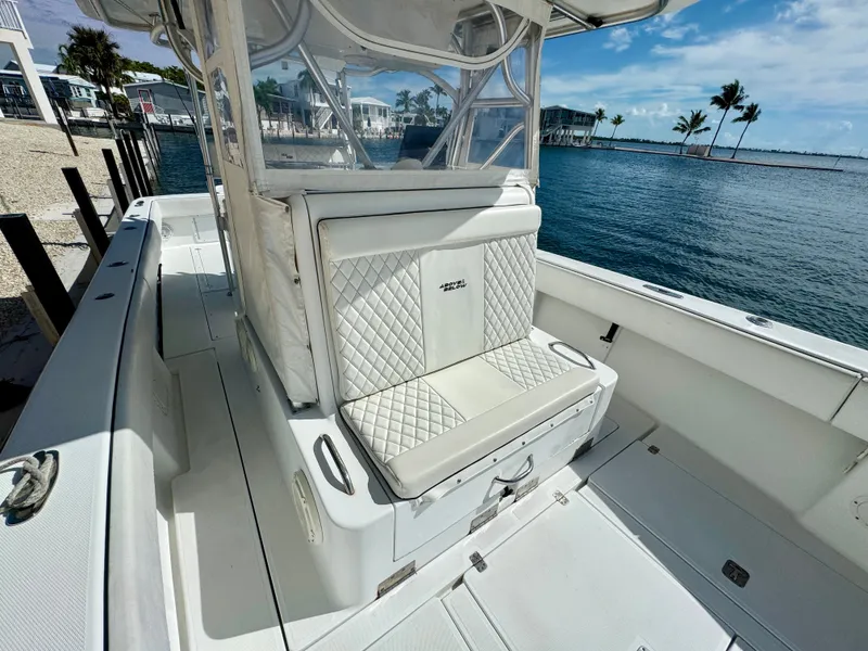 Slide: The Image of Interior of a 2000 SeaVee 340i boat by the water. - 27