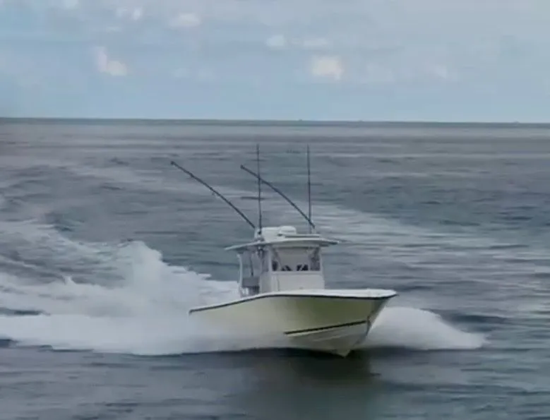 Slide: The Image of SeaVee 340i boat from 2000 cruising on the ocean. - 3