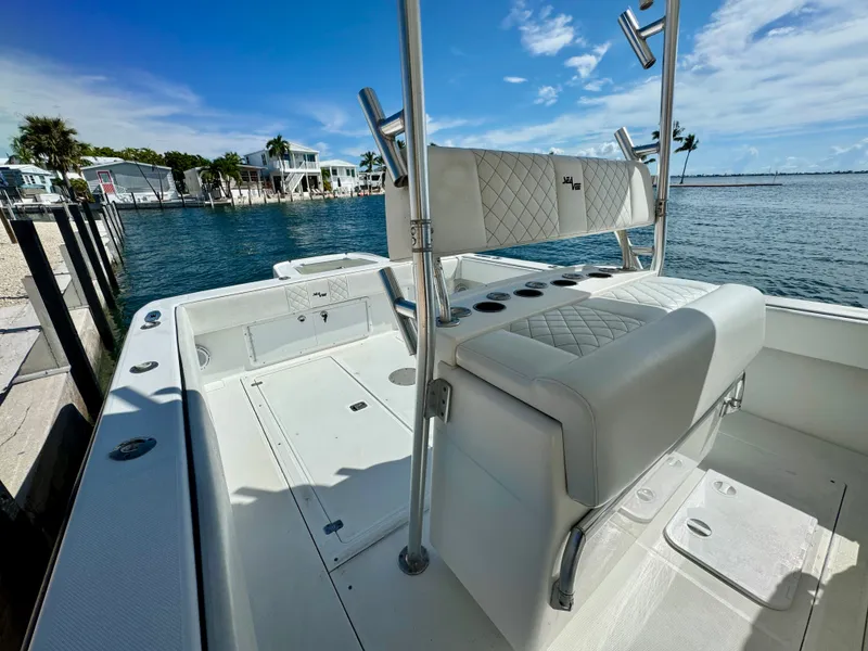 Slide: The Image of SeaVee 340i boat from 2000 by the water, sunny day. - 30