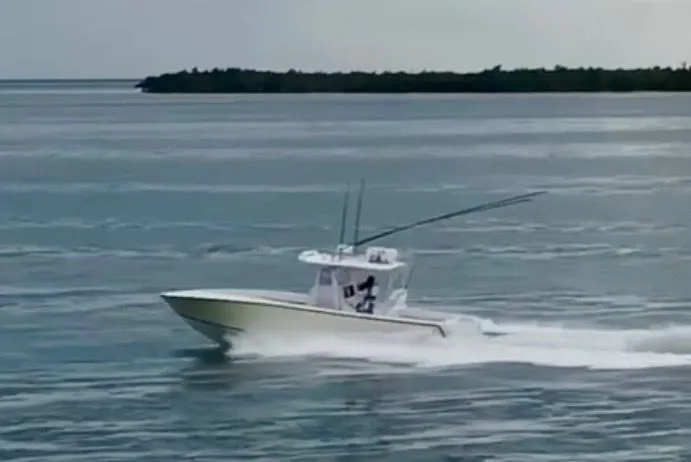 Slide: The Image of 2000 SeaVee 340i boat cruising on the water. - 6