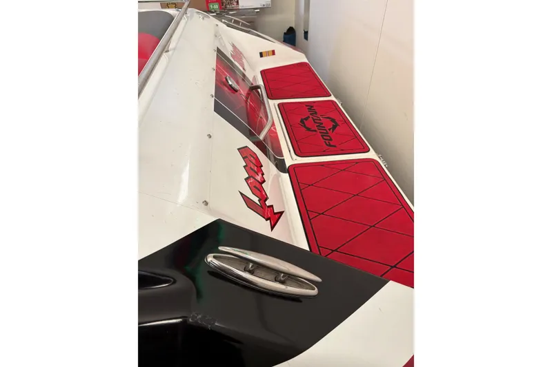 Slide: The Image of 2006 Fountain 42 Lightning boat with red and black detailing, sleek design. - 17