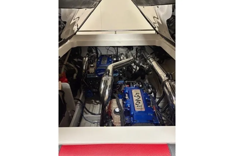 Slide: The Image of Engine compartment of a 2006 Fountain 42 Lightning boat, featuring dual high-performance engines. - 18