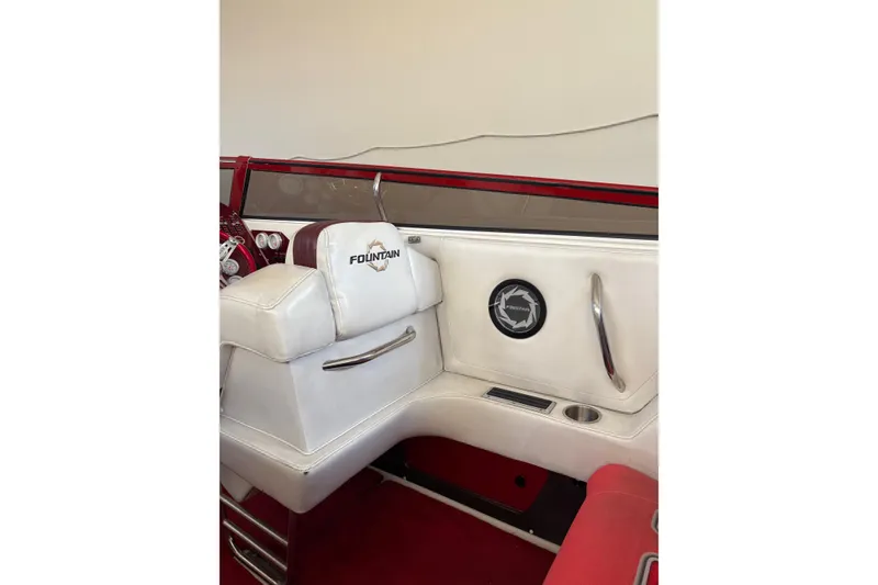 Slide: The Image of 2006 Fountain 42 Lightning boat interior with white seating and red accents. - 30